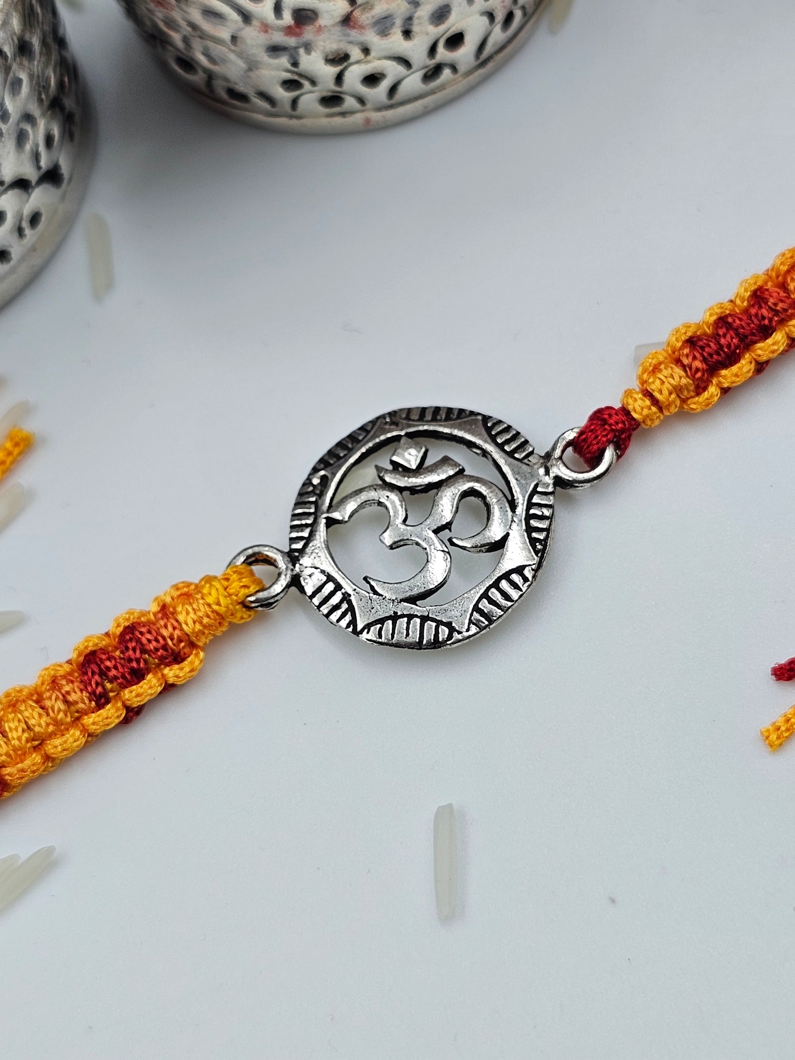 Om Silver Rakhi by GinniSilver