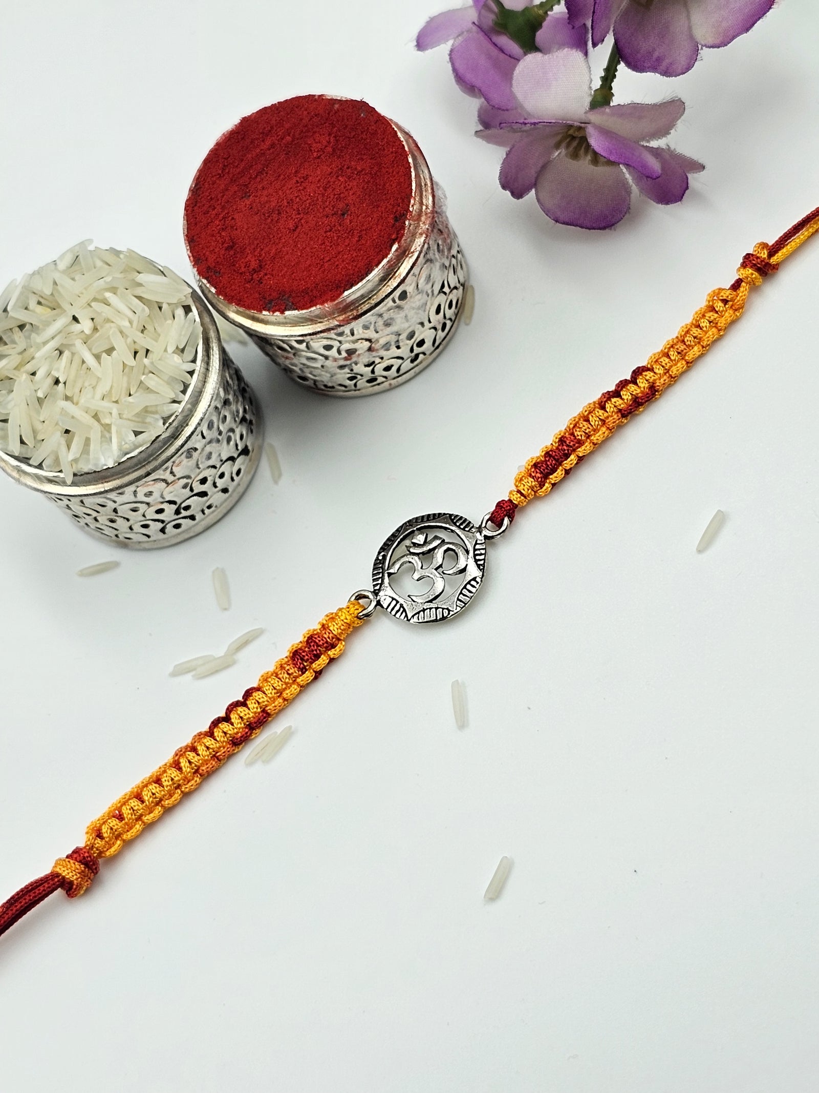 Om Silver Rakhi by GinniSilver